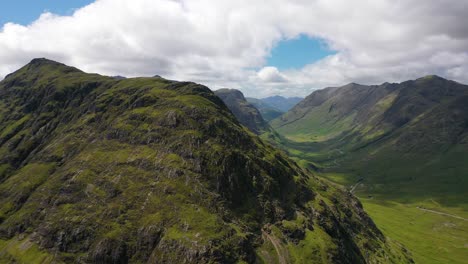 dramatic aerial shot of mountains in glencoe, the scottish highlands, scotland, uk