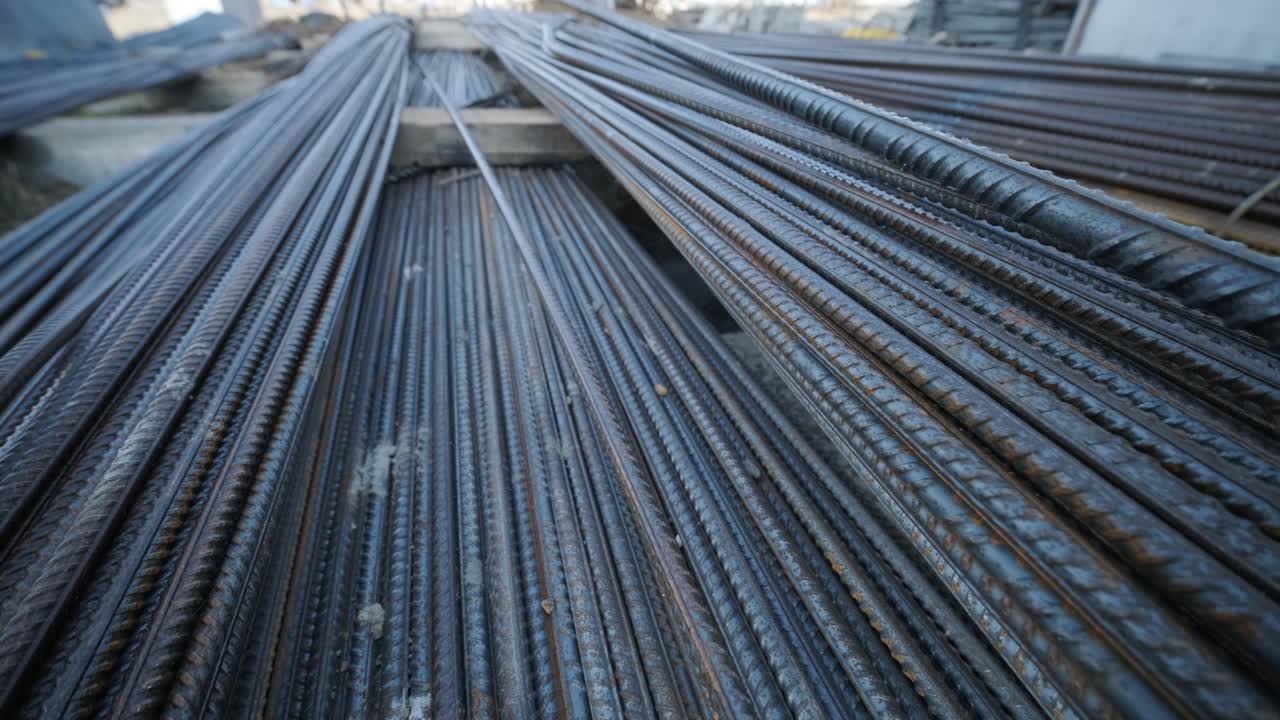 A large bundle of iron construction fittings in close-up