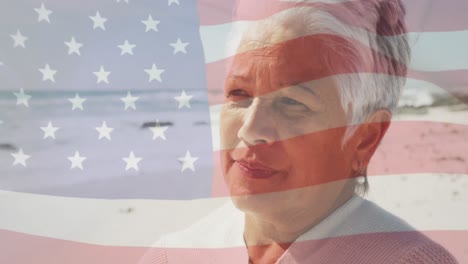 animation of flag of usa and football over senior biracial woman