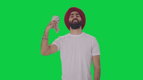 Glücklicher-Sikh-Indianer,-Der-Geld-Als-Fan-Greenscreen-Verwendet