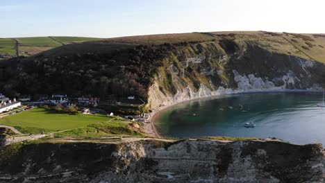 lulworth cove during morning. aerial dolly left