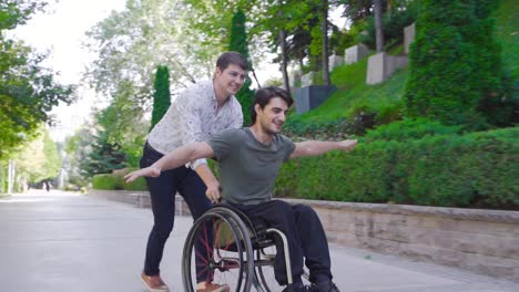 young happy disabled man pushing wheelchair in city park.