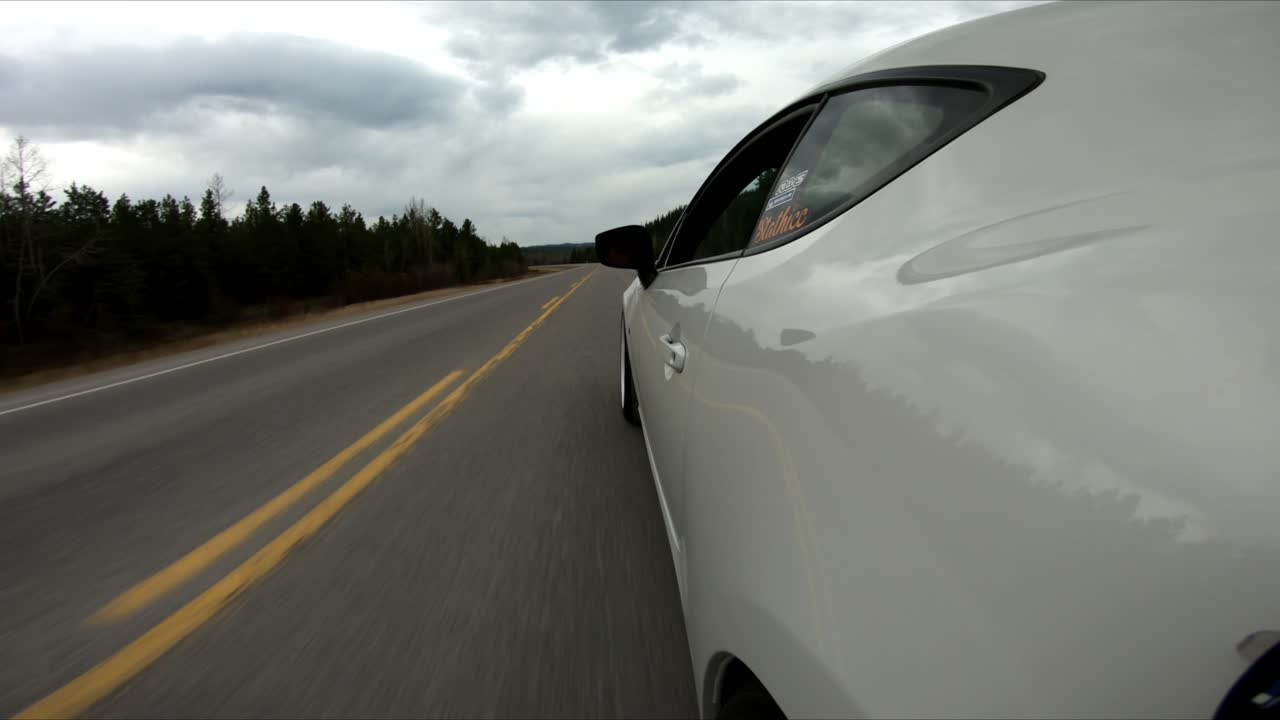 Side view of a car driving in the highway