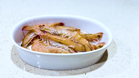 prawns arranged in a bowl for cooking