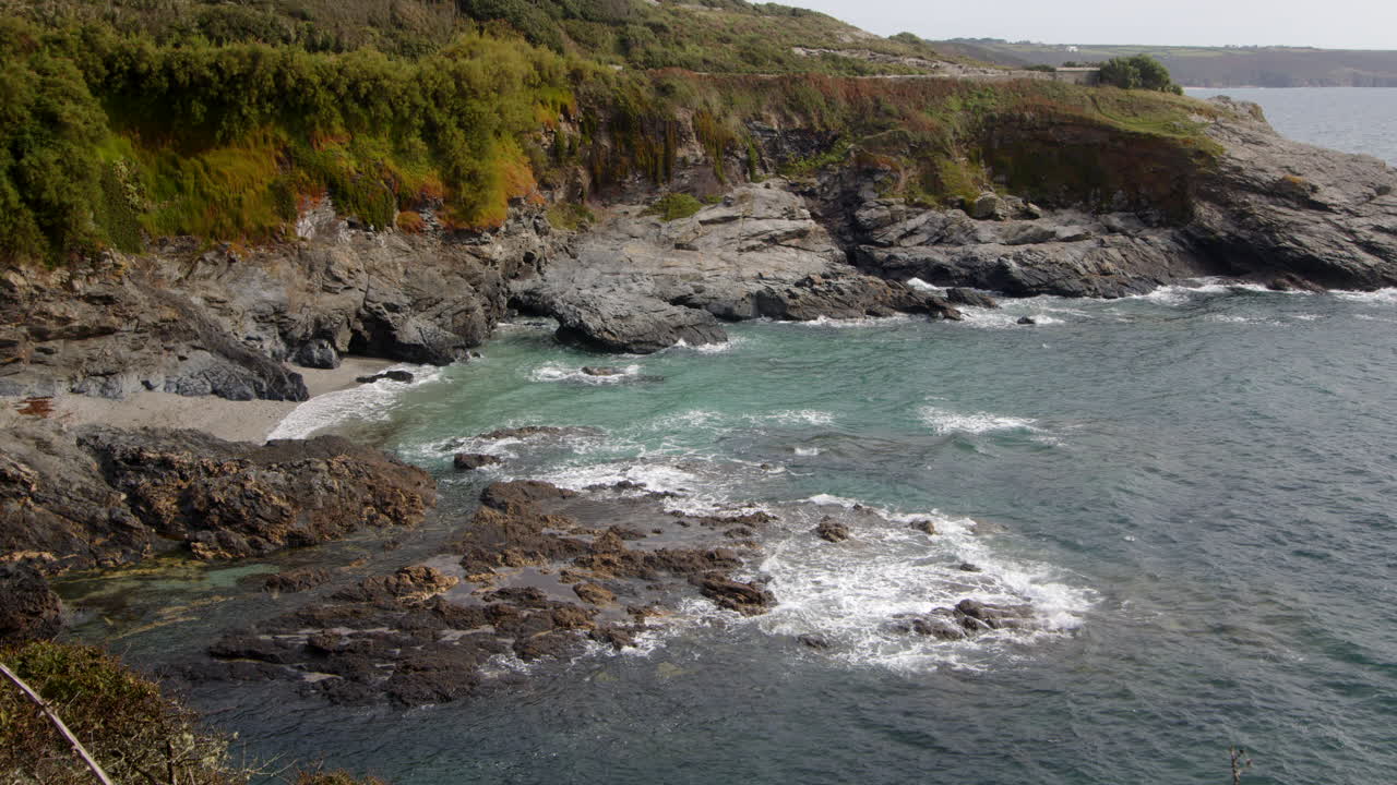 Wide shot of the sea and rocks at Bessy's Cove, The Enys taken from the Coastal path , cornwall