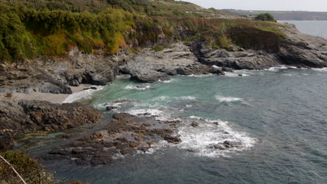 Wide-shot-of-the-sea-and-rocks-at-Bessy's-Cove,-The-Enys-taken-from-the-Coastal-path-,-cornwall