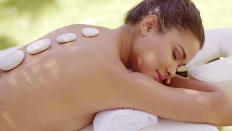 Woman-having-a-hot-stone-spa-massage