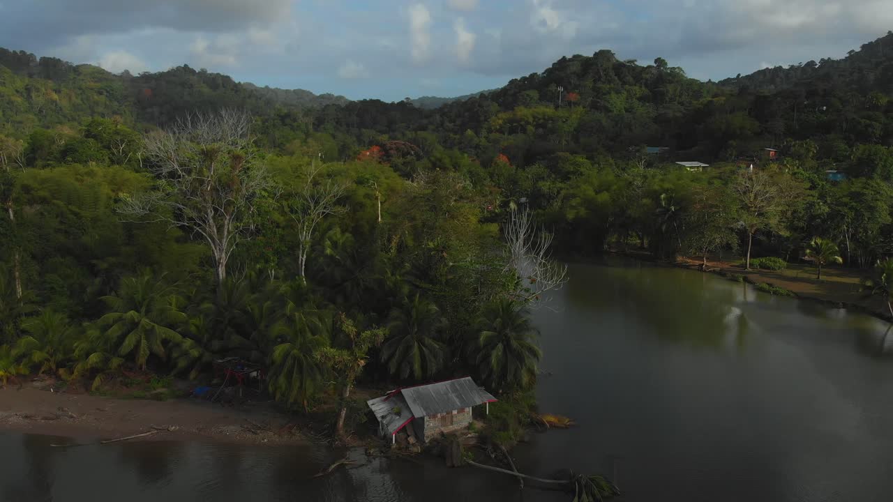Amazing aerial of a historic house along the river banks at Grande Riviere beach on the Caribbean island of Trinidad