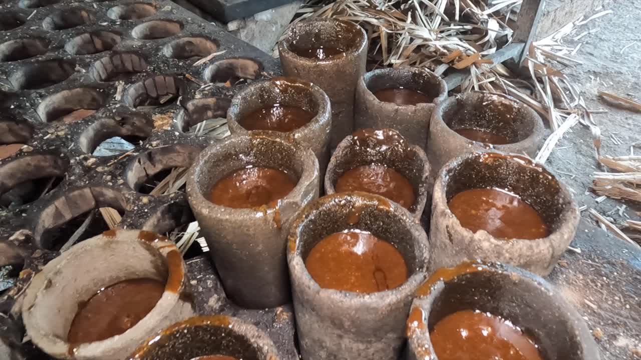 Sugar cane syrup cooling in molds at El Paradero, Sucre, Venezuela
