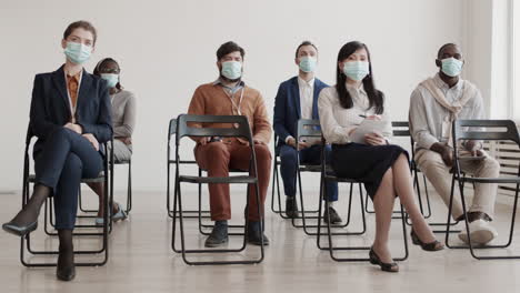 business people wearing masks on conference
