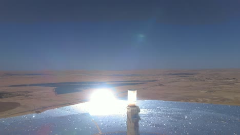 tallest solar power tower in the world close-up view - the mirrors bend the light - aerial drone shot