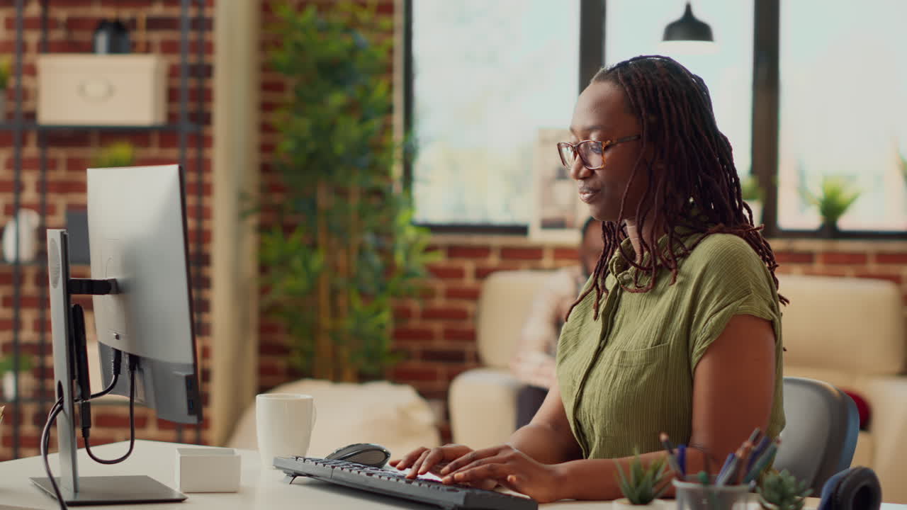 African american worker working from home on company job