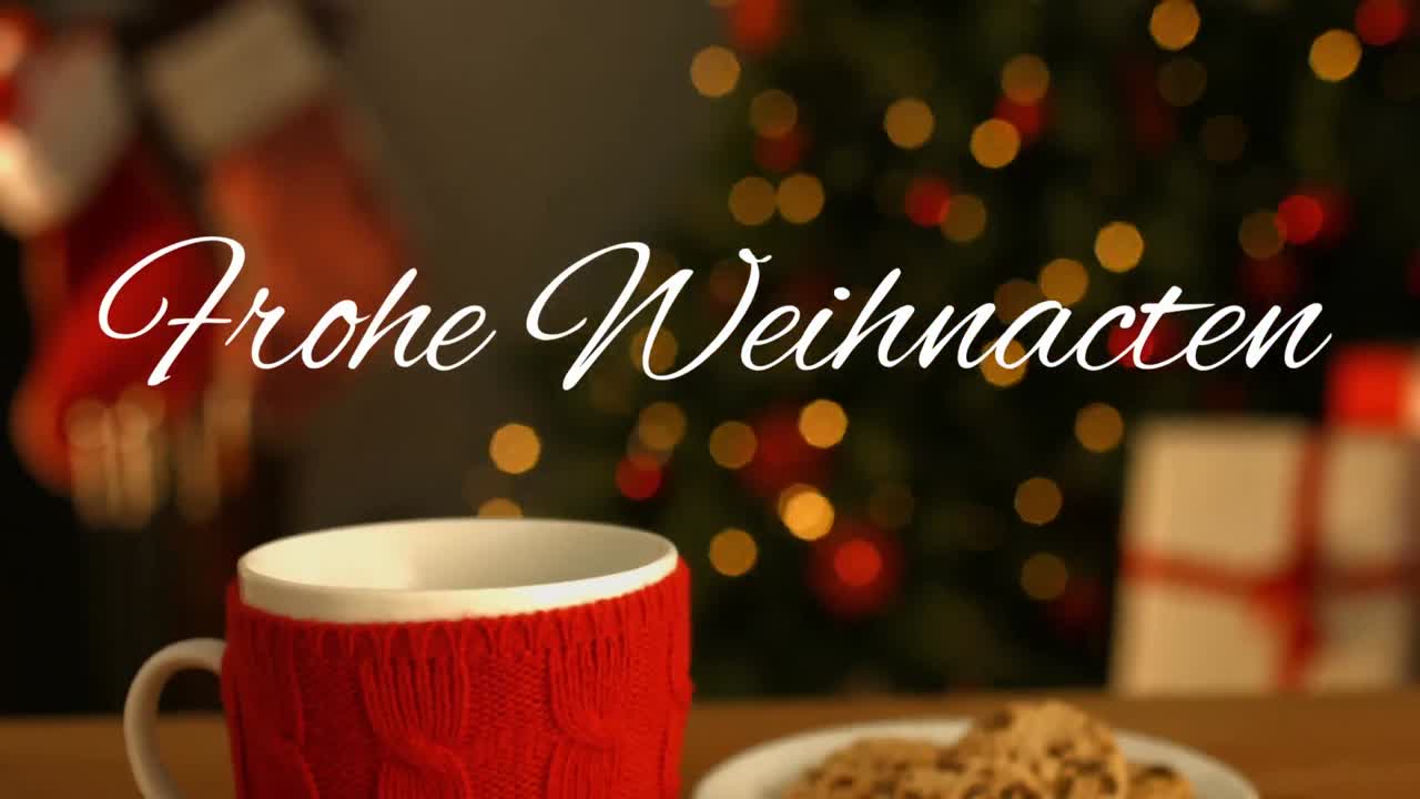 쿠키와 함께 컵과 접시 위에 쓰인 frohe weihnachten