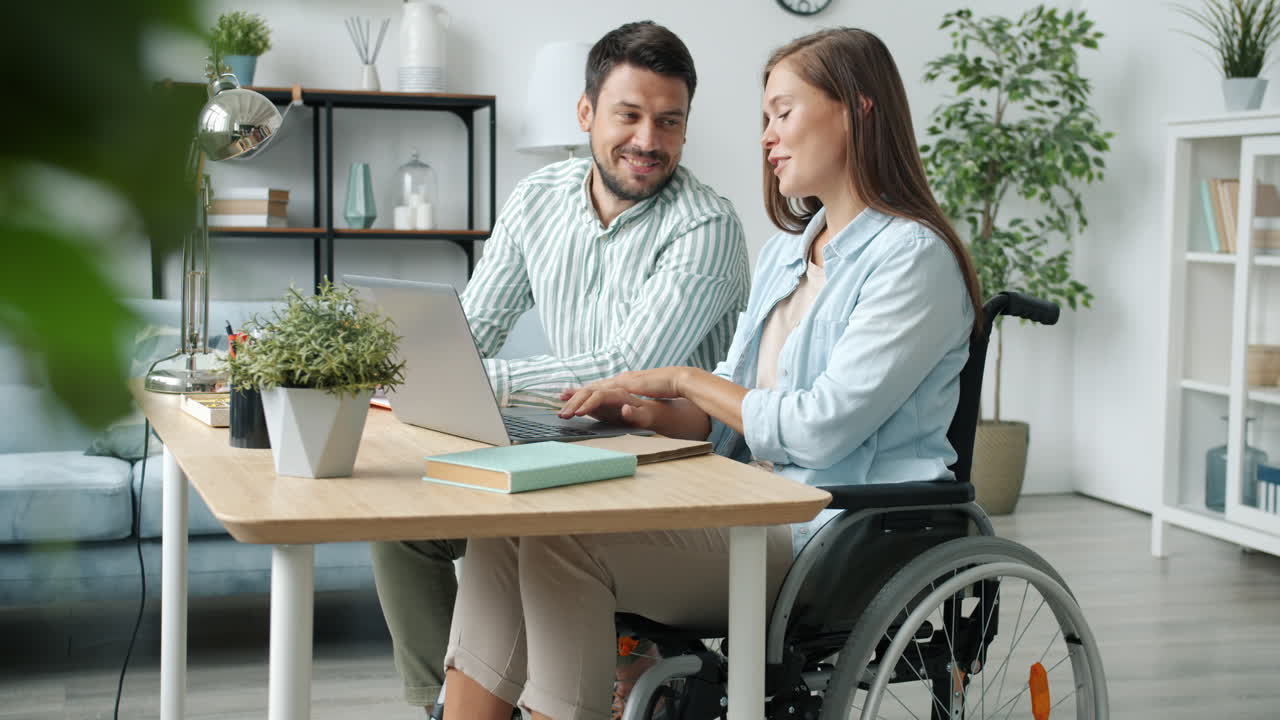 Couple Working Together on Laptop at Home