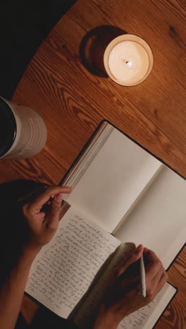 night study with notebook and candle