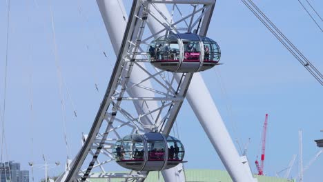 ferris wheel cabins rotating in london, england