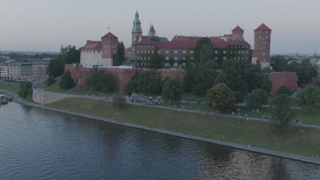 Aerial-Drone-Shot-of-Krakow-Poland-Wawel-Castle-Old-Town-with-the-river-Vistula-at-Sunset