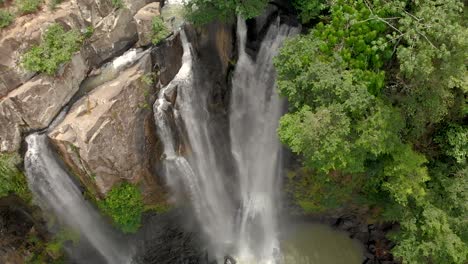 aerial of huge waterfall in the jungle