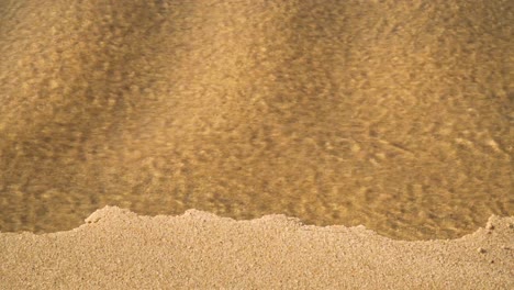 4k coastal sand erosion on beach after heavy rain as water carved her way into the ocean