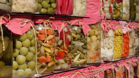 assortment of pickled vegetables in glass jars