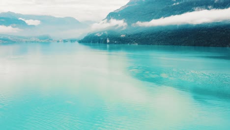 clear blue waters of lake thun on a cloudy summer's day