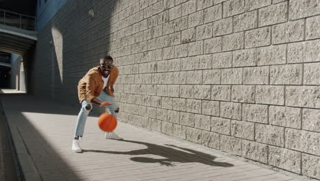 man playing basketball in the city