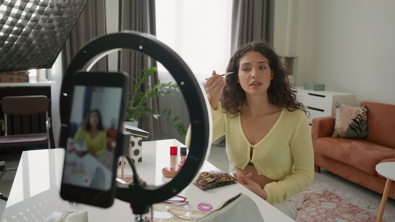 Woman Telling about Makeup Brush as Filming Beauty Vlog in Home Studio