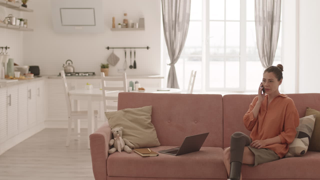 Woman with Disability Making Telephone Call