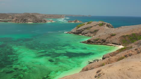 the white sand beach of tanjung aan in lombok, indonesia during a sunny day