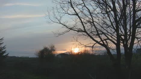 timelapse of sun setting over french countryside