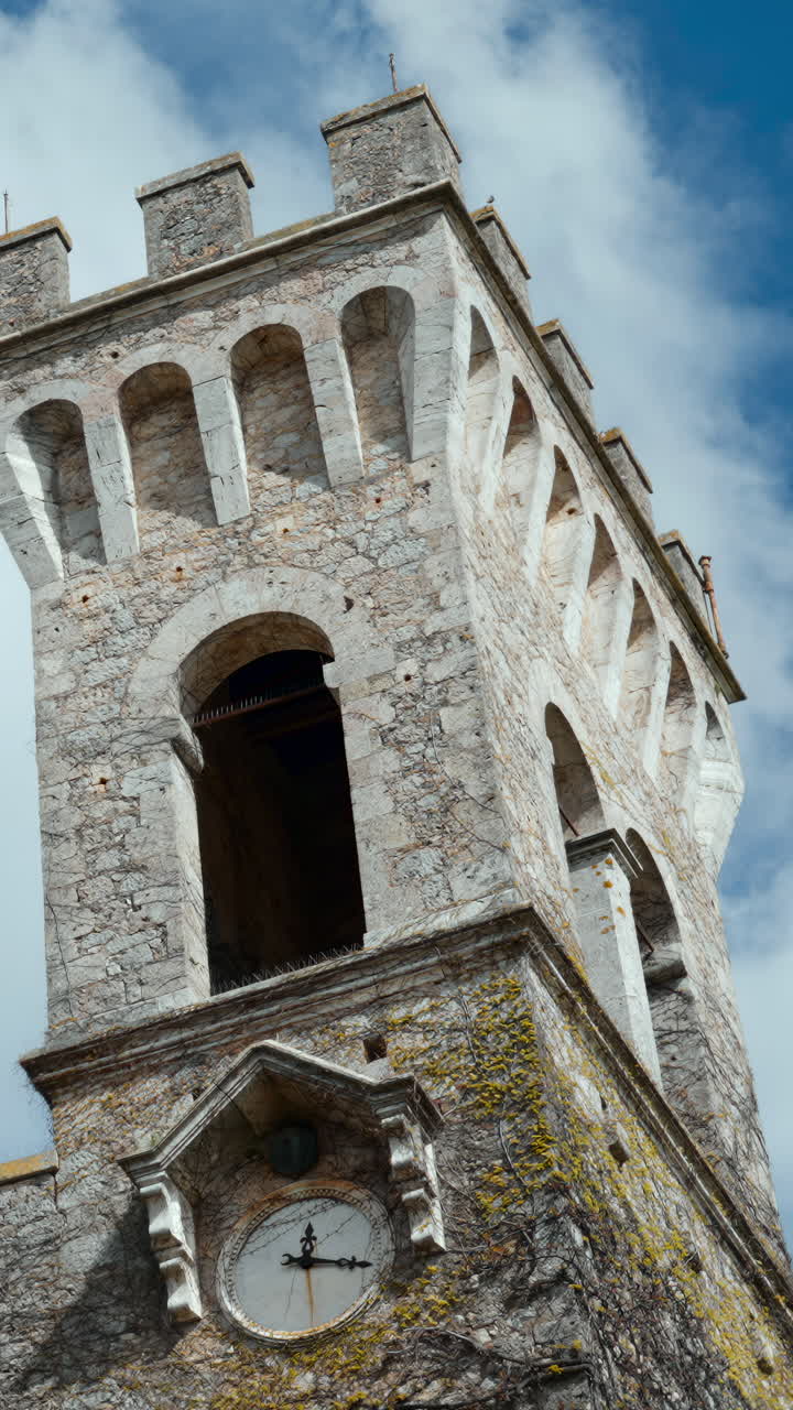 Close-up View of a Stone Clock Tower