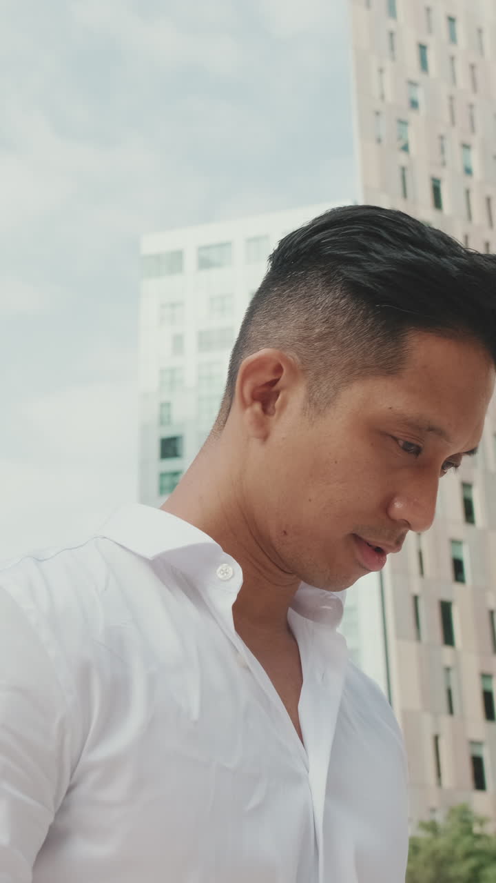 Man in White Shirt in Urban Setting