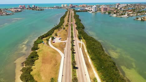 Aerial-tilt-up-shot-of-a-freeway-in-Clearwater-Beach-in-Florida-with-hotels-in-the-horizon