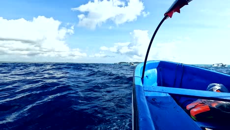 Sailing-in-fiber-boat-looking-for-dolphins-in-sunny-day,-Zanzibar