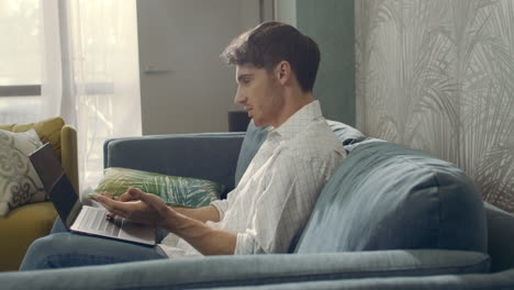 handsome businessman having video call on computer. smiling man chatting laptop