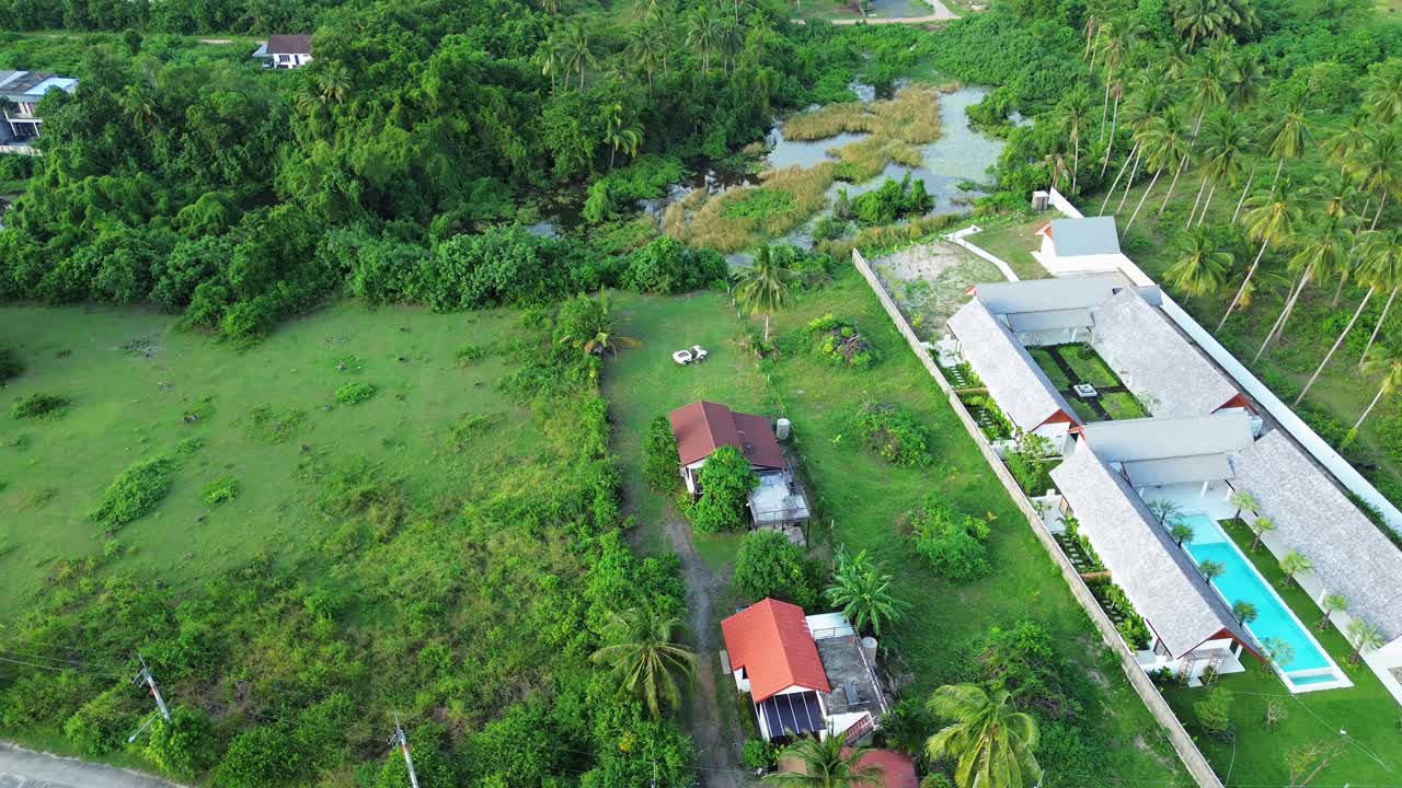 Hotel resort with swimming pool Koh Samui Thailand jungle Lamai region, aerial