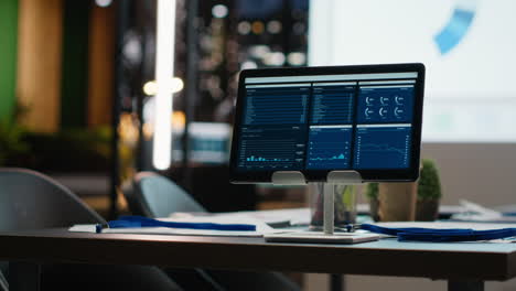 Empty corporate dark office with analytics tools on a projection screen
