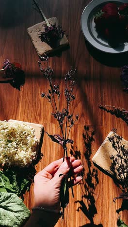 floral arrangement on wooden table with berries