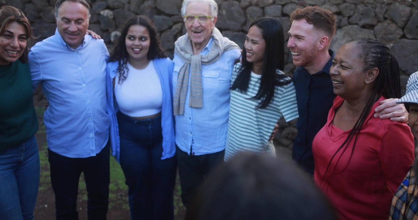 Happy Multi-Generational and Multi-Ethnic Group of Friends Laughing Together
