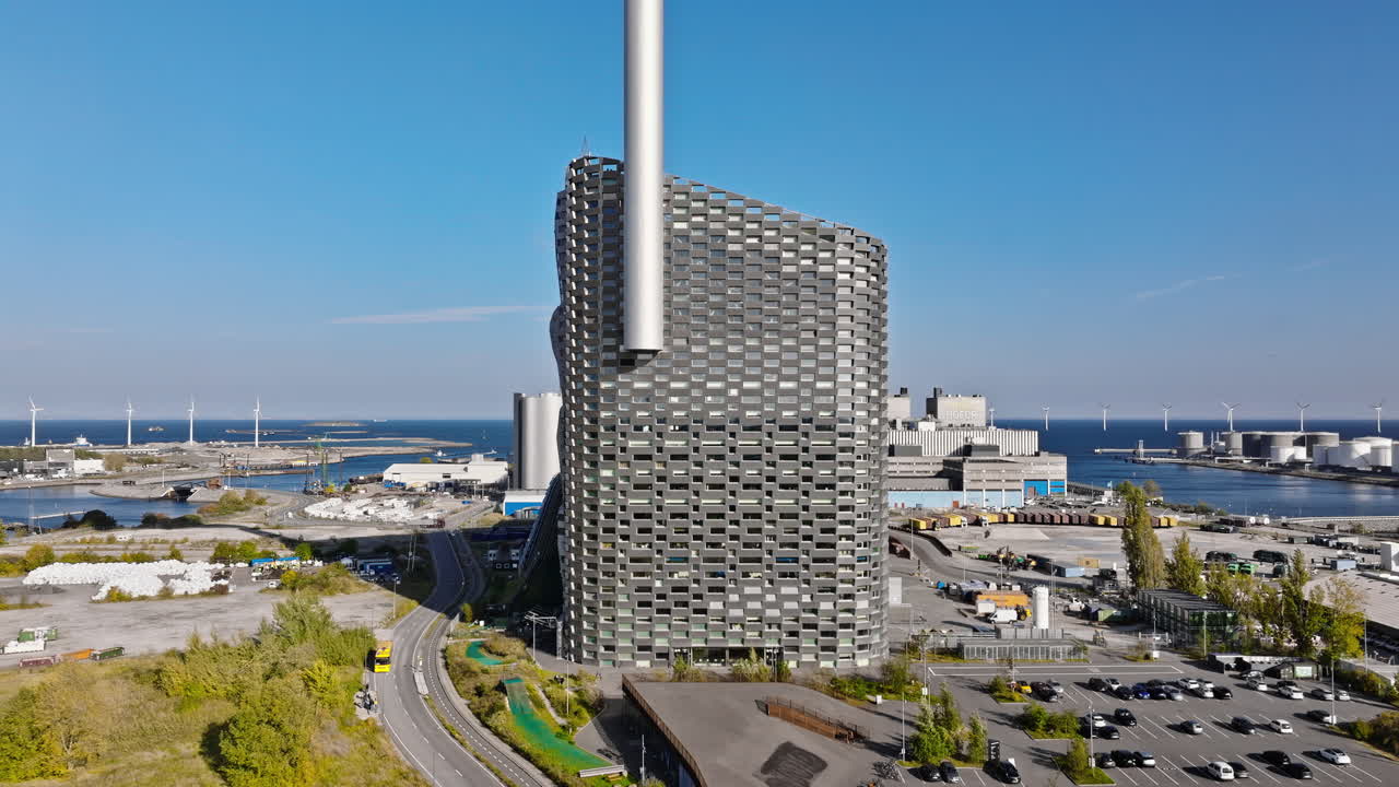 Aerial drone view of CopenHill artificial ski slope on the roof of an energy plant