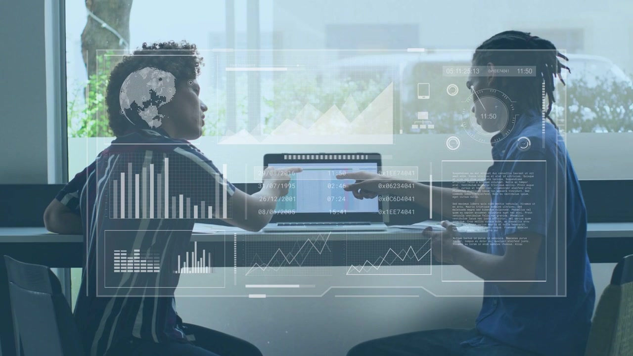 Two colleagues, right colleague pointing at laptop screen, HUD animating charts for business review
