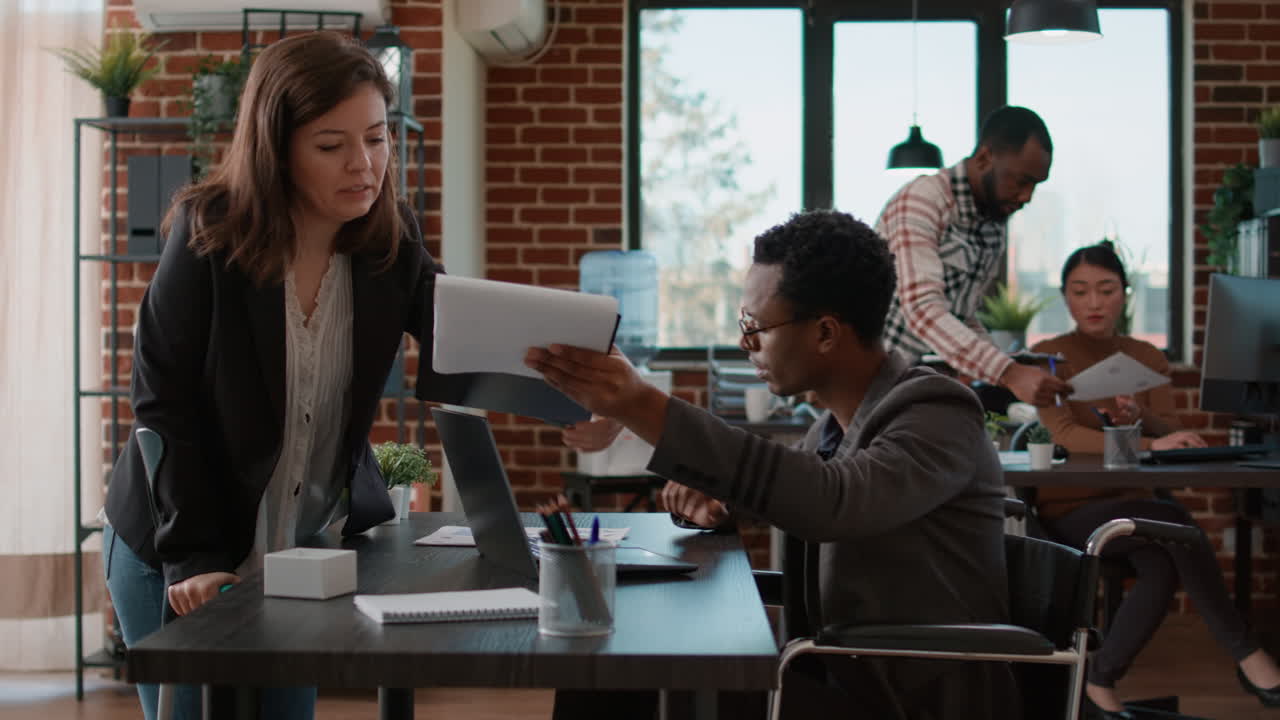 Businesspeople analyzing financial charts on work papers