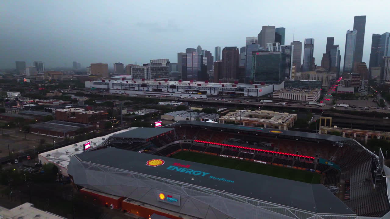 Aerial view of the Shell Energy stadium and the Houston skyline, storm background
