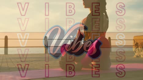 Digital-composition-of-vibes-text-against-woman-practicing-yoga-on-the-promenade