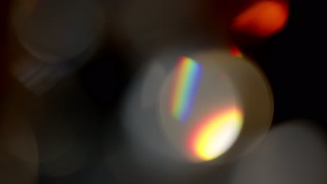 Multicolored-light-leaks-footage-on-black-background,-lens-flare-leak-burst-overlays-transitions