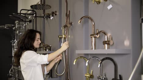 woman shopping for bathroom fixtures in a store