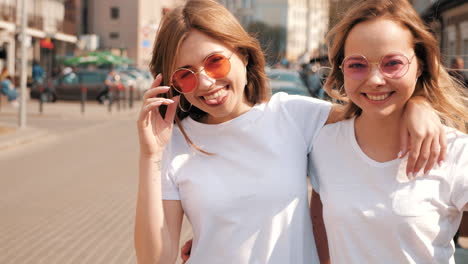 two happy women friends enjoying the city