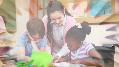 Animation-of-crayons-rotating-over-happy-diverse-pupils-learning-at-school