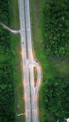 sunset drone view evening at pan borneo highway with green forest and mountain,sarawak.