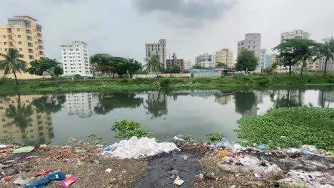 water pollution with various trash in dhaka city, bangladesh